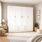 Armario 4 puertas blanco con dos cajones en un dormitorio con mesita y cama