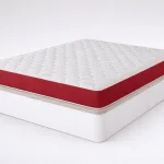 Pack Eco21 HR + canapé Low: colchón con lateral rojo sobre canapé blanco